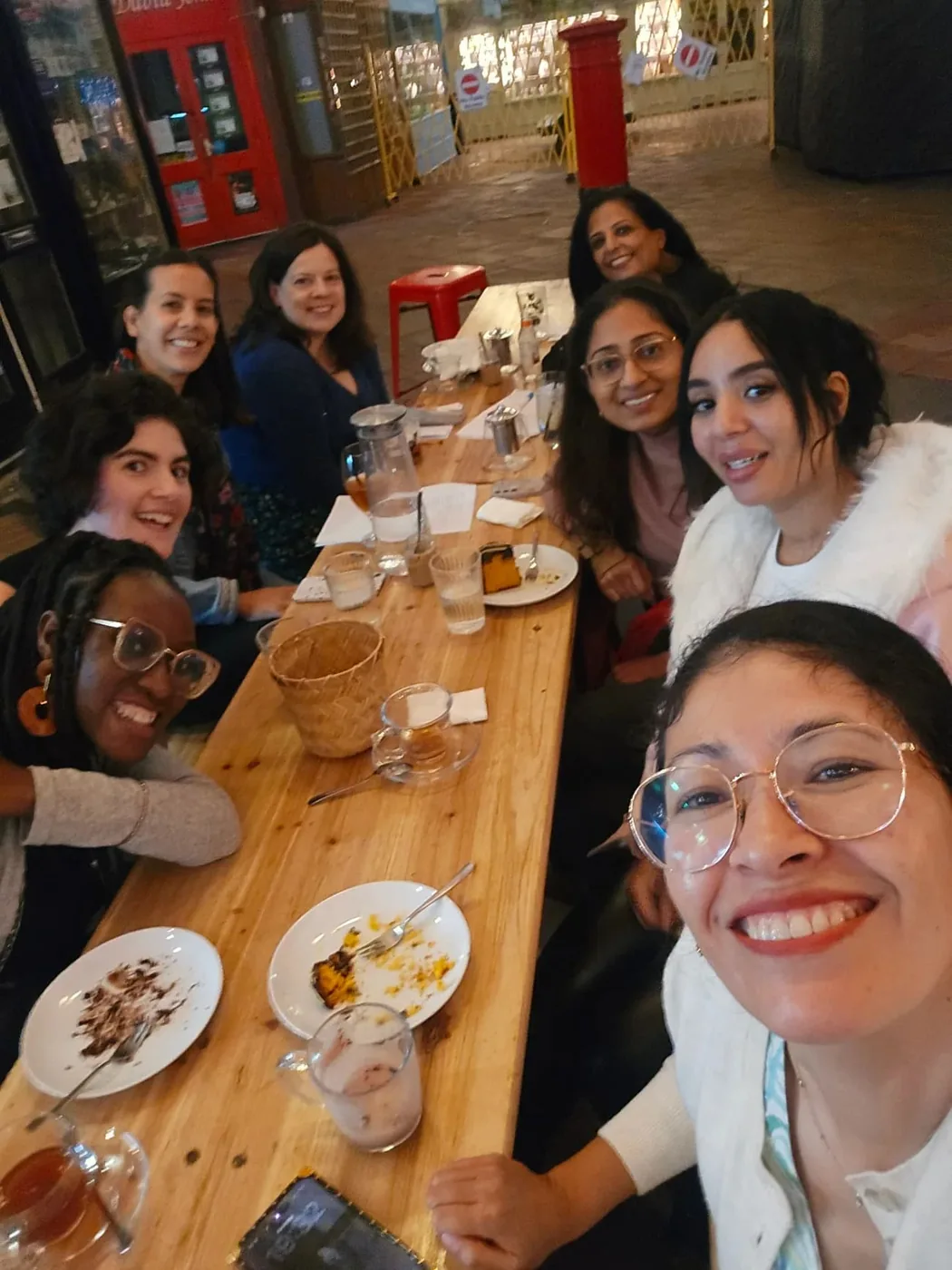 A group sharing a meal around a long table